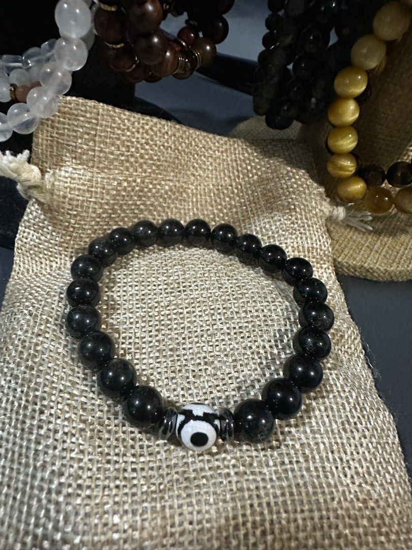 Silver Sheen obsidian with evil eye (Category: Bracelets) located in Cainta. Submitted by annebc (Listing ID 1386191849, Image 1). Description: 8mm silver sheen obsidian with evil eye and hematite 16cm wrist size.
