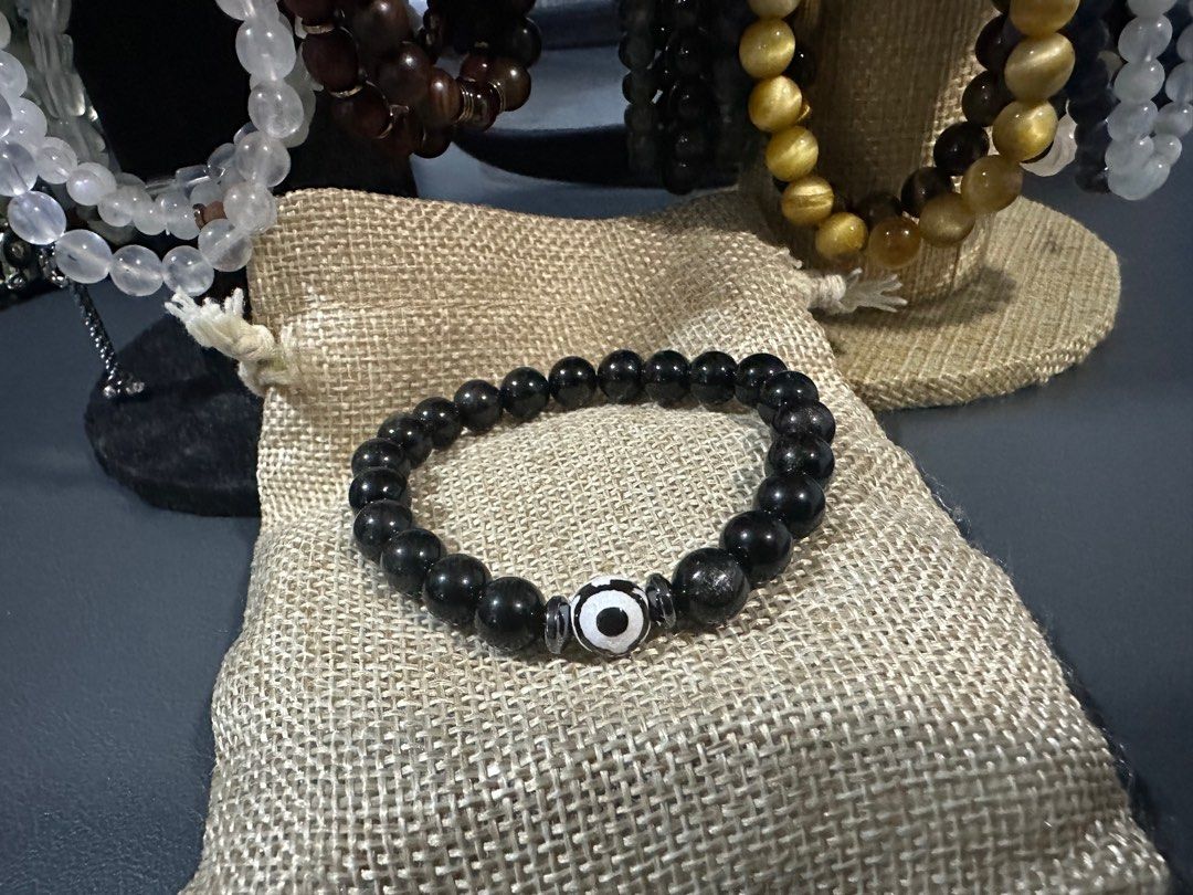 Silver Sheen obsidian with evil eye (Category: Bracelets) located in Cainta. Submitted by annebc (Listing ID 1386191849, Image 2). Description: 8mm silver sheen obsidian with evil eye and hematite 16cm wrist size.