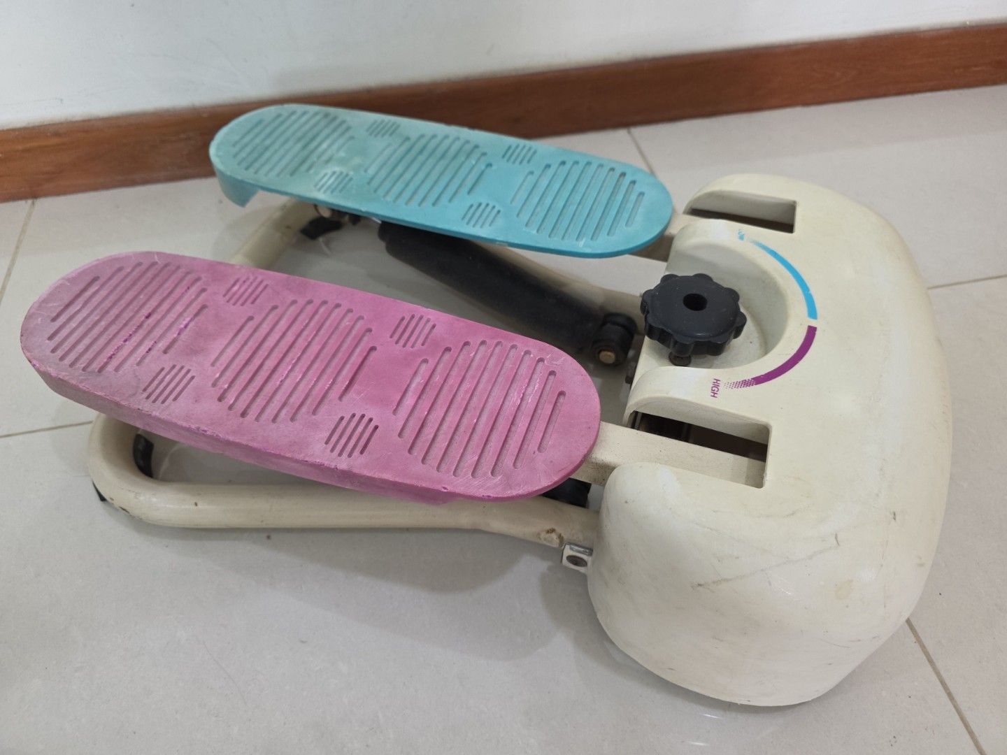 Stepper Machine (Category: Cardio & Fitness Machines) located in Singapore. Submitted by carrouseller (Listing ID 1386011275, Image 2). Description: - Stepper in good working condition. - Features pink and blue foot pedals. - Adjustable resistance via black knob. - Ideal for home exercise..