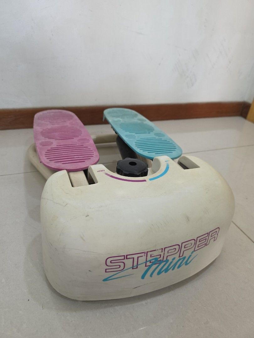 Stepper Machine (Category: Cardio & Fitness Machines) located in Singapore. Submitted by carrouseller (Listing ID 1386011275, Image 1). Description: - Stepper in good working condition. - Features pink and blue foot pedals. - Adjustable resistance via black knob. - Ideal for home exercise..