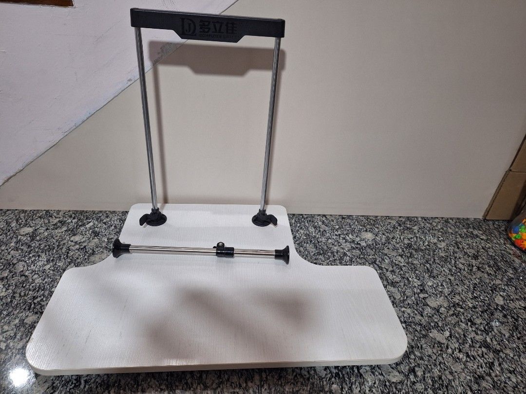 Adjustable Computer Table (Category: Tables & Sets) located in Singapore. Submitted by mini.bunnies (Listing ID 1386359868, Image 1). Description: - Excellent condition - Adjustable table - White tabletop - Sturdy frame - Ideal for laptop or small desk - Easy height adjustment.