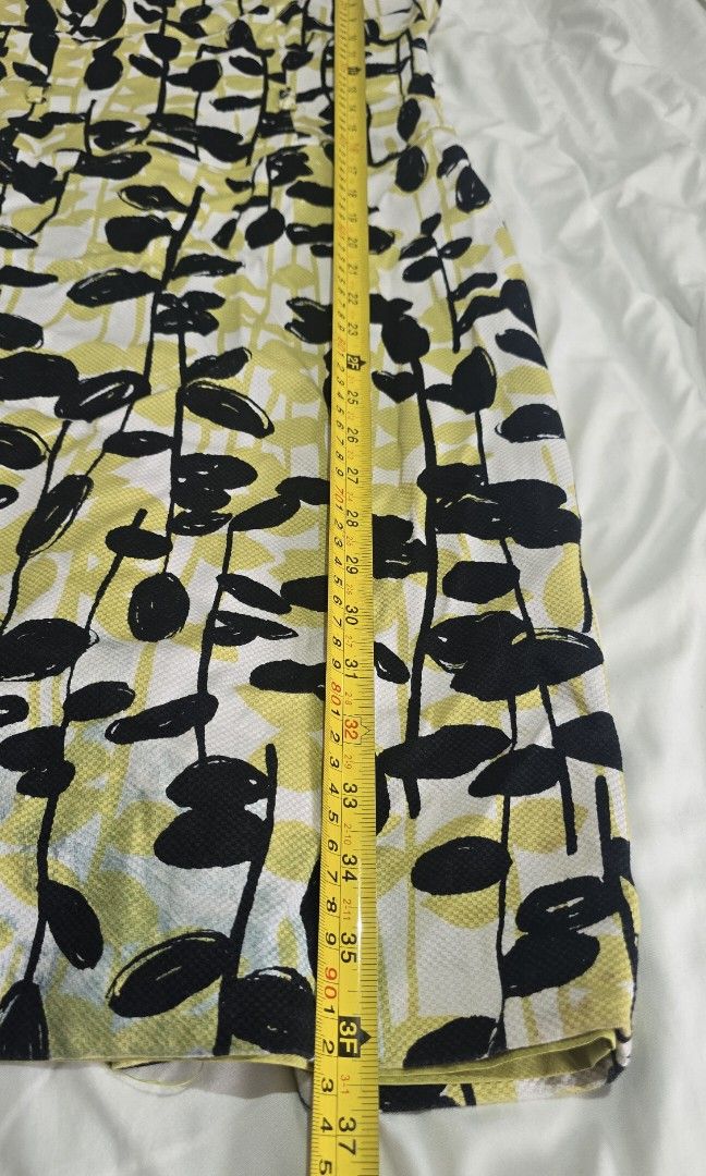 Adrianna Papell Dress (Category: Dresses) located in Quezon City. Submitted by ronbel (Listing ID 1386226301, Image 3). Description: Title: Preloved Dress – Adrianna Papell – size 6 – Yellow Description: ✨ Condition: Lightly used, some discoloration below(please see 6th picture) 📏 Size: based on the Tag size 6 🎨 Color: Yellow with Black design 📝 Details: office wear, zip/button closure at the back. 📍 Location: [City/Area] 🚚 Shipping: [LBC / 