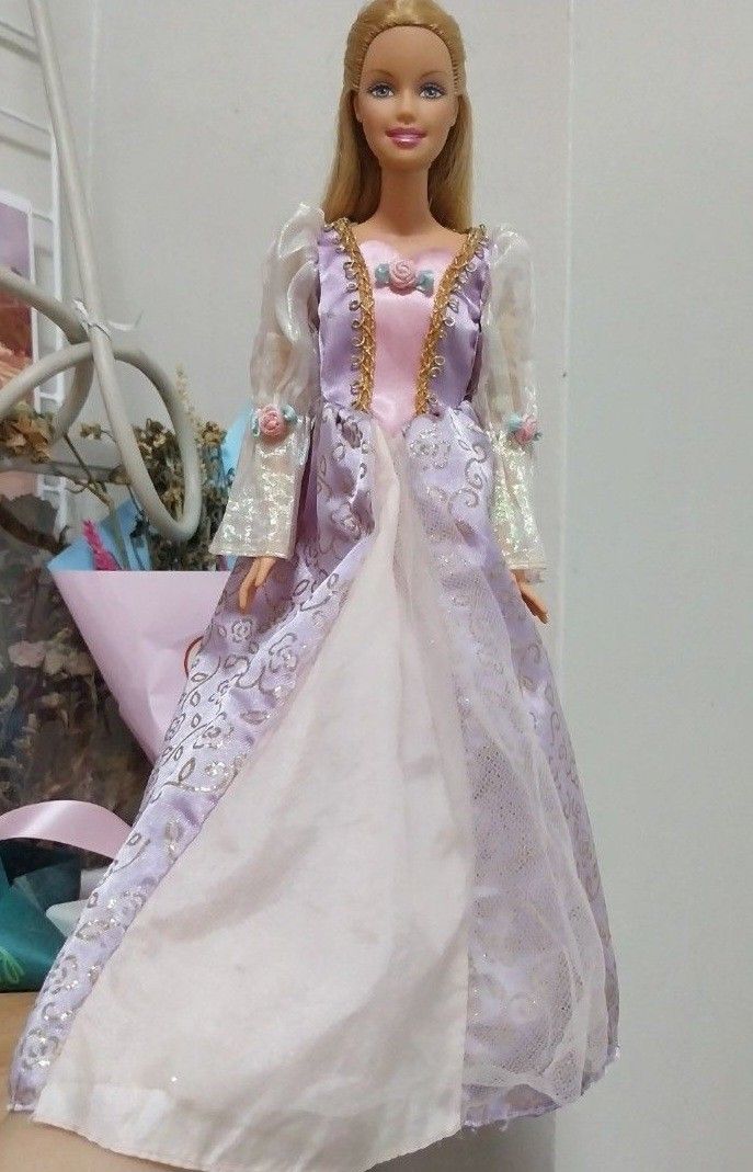 Barbie Rapunzel (Category: Kids Toys) located in Manila. Submitted by charmsbarbie8 (Listing ID 1386343695, Image 1). Description: Barbie Rapunzel No crack neck Hair gimmick still working -my slight flaw lang sa dress. unoticeable..