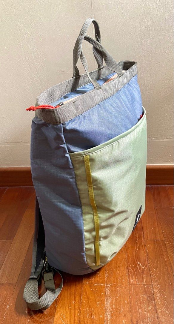 Cotopaxi Todo 16L Convertible Tote - Cada Dia (Category: Backpacks) located in Singapore. Submitted by csthg (Listing ID 1386245585, Image 3). Description: - Cotopaxi Todo 16L Convertible Tote in excellent condition. - Eye-catching blue and green color scheme. - Convenient top handle. - Adjustable shoulder straps for a comfortable fit. Straps can be stowed away when used as a tote. - Suitable for everyday use and travel. - Meet up only to transac