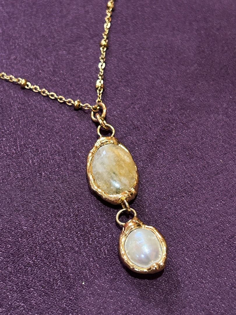 Gold Double Oval Pendant Necklace (Category: Necklaces) located in Quezon City. Submitted by martits (Listing ID 1386270538, Image 2). Description: Chic gold-tone necklace with two oval pendants (moonstone & pearl) on a delicate chain. Minimalist yet elegant. Dimensions: · Laid flat, chain is 9.5" · Pendant is 2" Used once only and newly purchased from Kultura. Original price is 2300!.
