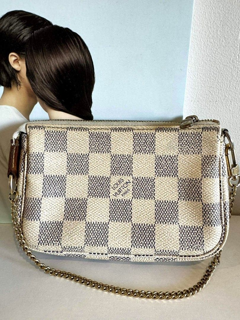 LV MINI pochette damier azur with authenticity cert (Category: Luxury Bags & Wallets) located in Davao. Submitted by second.chances.preloves (Listing ID 1386345760, Image 1). Description: LV mini pochette damier azur💯 📌 Purchase history: bought from AACD member Japan store (Association Against Counterfeit product Distribution) 📌 Condition: BC, with signs of use, faded zipper hardware, dark brown vachetta leather, inked interior 📌 Inclusion: a