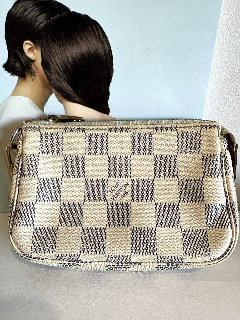 LV MINI pochette damier azur with authenticity cert (Category: Luxury Bags & Wallets) located in Davao. Submitted by second.chances.preloves (Listing ID 1386345760, Image 2). Description: LV mini pochette damier azur💯 📌 Purchase history: bought from AACD member Japan store (Association Against Counterfeit product Distribution) 📌 Condition: BC, with signs of use, faded zipper hardware, dark brown vachetta leather, inked interior 📌 Inclusion: a