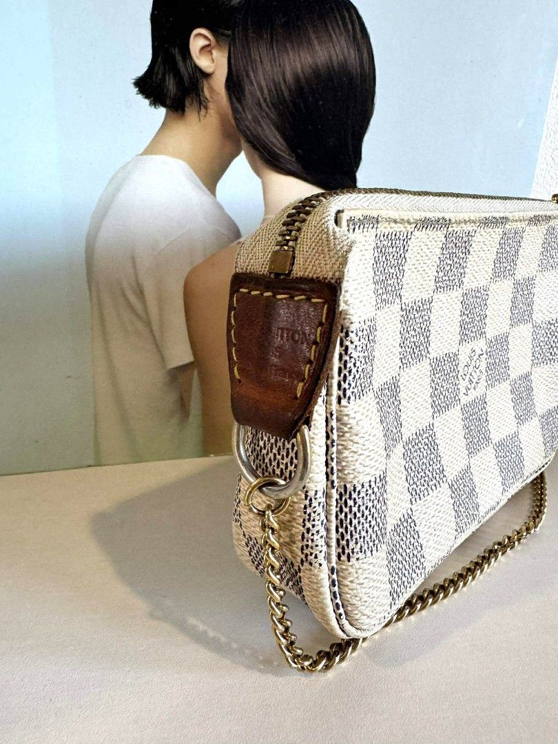 LV MINI pochette damier azur with authenticity cert (Category: Luxury Bags & Wallets) located in Davao. Submitted by second.chances.preloves (Listing ID 1386345760, Image 3). Description: LV mini pochette damier azur💯 📌 Purchase history: bought from AACD member Japan store (Association Against Counterfeit product Distribution) 📌 Condition: BC, with signs of use, faded zipper hardware, dark brown vachetta leather, inked interior 📌 Inclusion: a