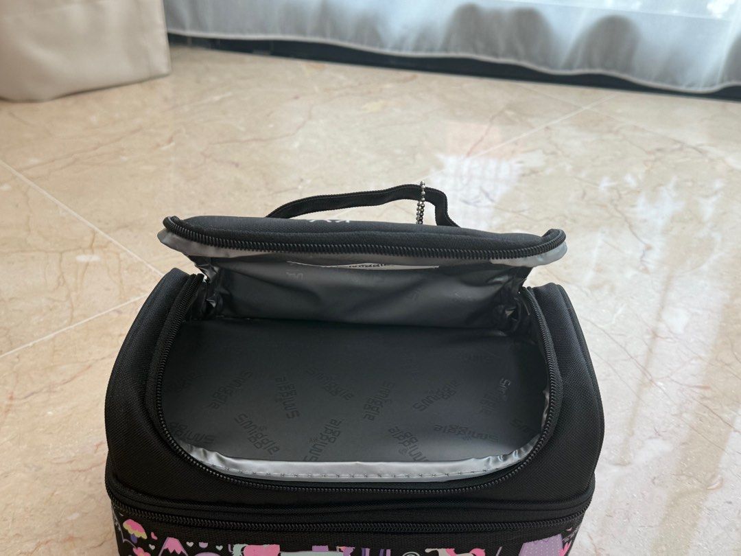 Smiggle Unicorn Double Decker Lunchbox (Category: Babies & Kids Fashion) located in Singapore. Submitted by Behappy (Listing ID 1386277315, Image 3). Description: - Smiggle lunchbox, perfect for school or outings. - Features a fun unicorn print. - Double-decker design for food and drinks separation. - Includes a name tag inside. - Zippers in good working condition..