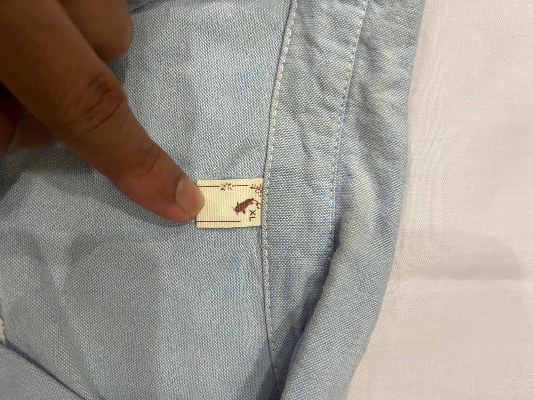 Work shirt (Category: Shirts) located in Shah Alam. Submitted by del0711 (Listing ID 1386230708, Image 2). Description: Reason for selling : Wardrobe clearance Material : Cotton Item is nicely kept. Condition is good. Length : 61 cm Width : 55 cm .