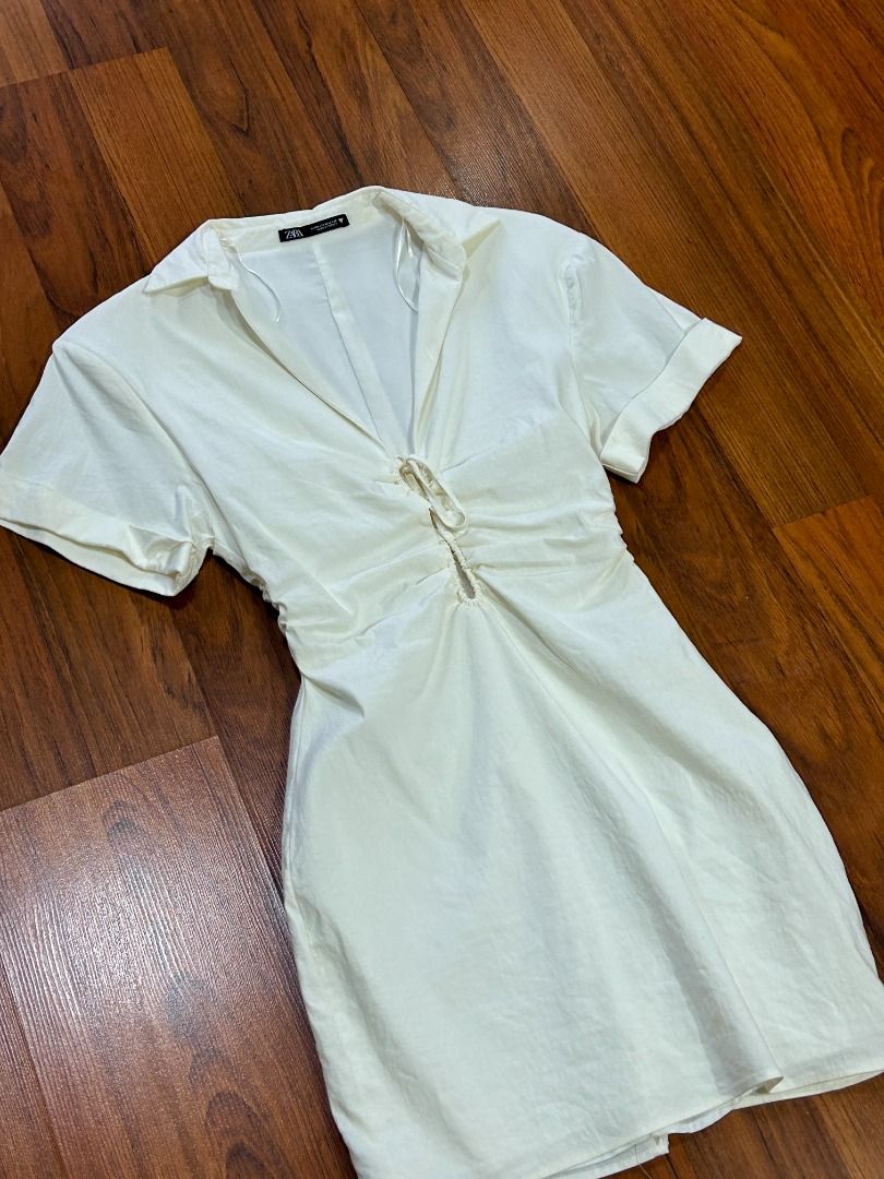 ZARA Ecru Linen Blend Mini Dress (Category: Dresses) located in Quezon City. Submitted by martits (Listing ID 1386266572, Image 2). Description: Minimalist white collared mini dress with ruched front tie detail that you can style in different ways. Perfect for summer outings or casual brunch dates. Style with sneakers for day wear, or with heels and a clutch for night events..