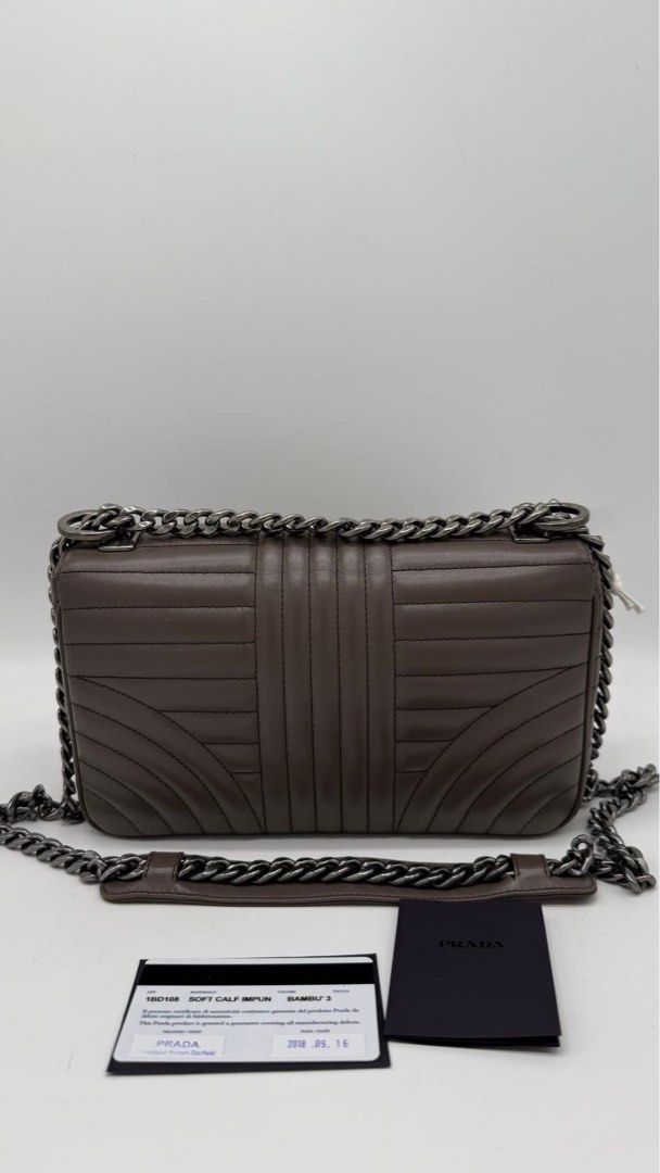 Authentic Prada diagramme flap (Category: Luxury Bags & Wallets) located in Quezon City. Submitted by jhaediah (Listing ID 1386587146, Image 2). Description: Prada diagramme flap etoupe color good condition with dustbag & card .