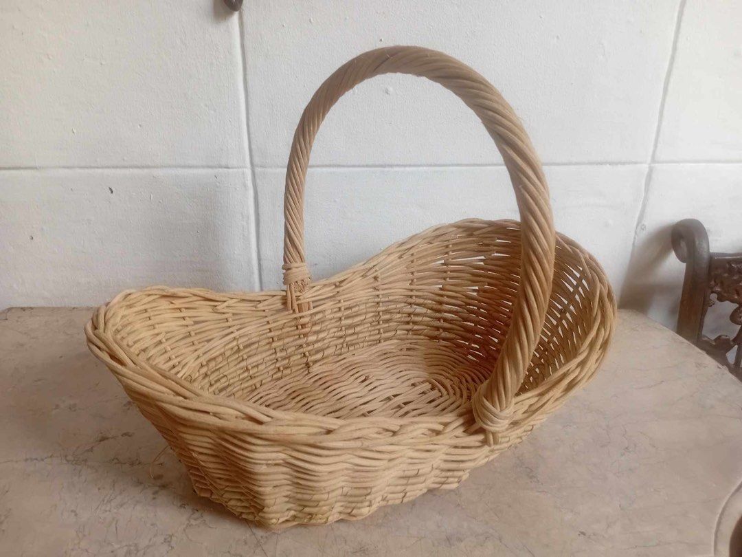Boat-shaped native basket (Category: Storage Boxes & Baskets) located in Manila. Submitted by laurenstaste (Listing ID 1386589868, Image 3). Description: Height including handle 11 inches Length 14 inches Width 10 inches Height of the basket 5 inches.
