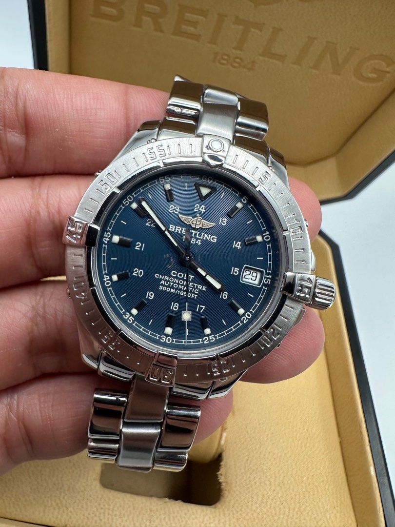 Breitling Colt Automatic Chronometer Deep Blue Dial COMPLETE BOX AND PAPERS (Category: Luxury Watches) located in Manila. Submitted by rj_authenticwatchesandmore (Listing ID 1386583273, Image 1). Description: ‼️Breitling Colt Automatic‼️ ✅Deep Blue Dial ✅Sapphire Crystal with AR coating both sides ✅Excellent used condition Dial 9.8/10 (small patina gold sunburst near center, common on blue dials) Case and bracelet 9.5/10 ✅Unit, inner and outer bo