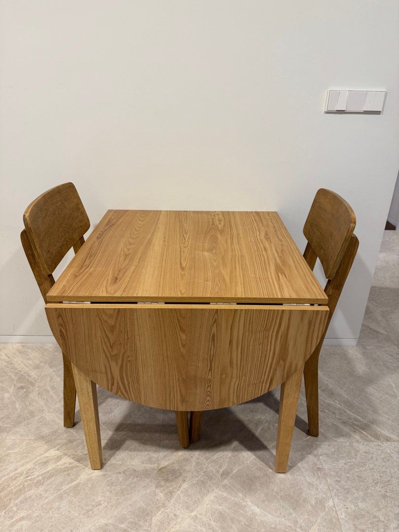Dining Table (Category: Tables & Sets) located in Singapore. Submitted by tracealot (Listing ID 1386513941, Image 1). Description: Like new set of dining table and two chairs. Dining table can be extended for additional space. 0.75 x 1.15m From HipVan, original price $399. .