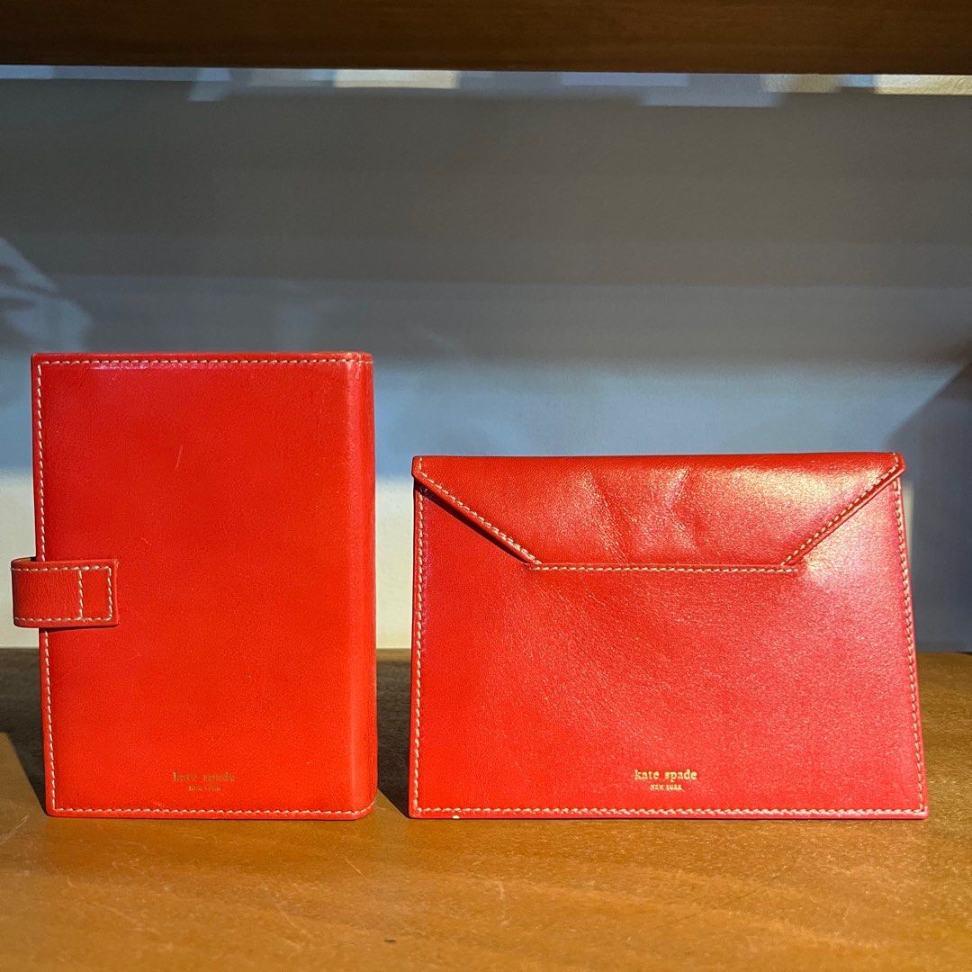 Kate Spade Leather Organizers/Holder (Category: Wallets & Card holders) located in Binan City. Submitted by lovedbynins (Listing ID 1386507496, Image 1). Description: 2 Kate Spade red leather items made in Italy. •Trifold Picture Frame Wallet Height - 6 in Width - 4.5 in • Organizer or document holder, envelop-like Height - 5 in Width - 6.5 in Passport fits in both organizers. Please check and zoom photos to check for details and minor flaws. Tha