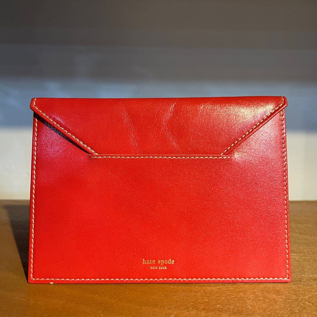 Kate Spade Leather Organizers/Holder (Category: Wallets & Card holders) located in Binan City. Submitted by lovedbynins (Listing ID 1386507496, Image 2). Description: 2 Kate Spade red leather items made in Italy. •Trifold Picture Frame Wallet Height - 6 in Width - 4.5 in • Organizer or document holder, envelop-like Height - 5 in Width - 6.5 in Passport fits in both organizers. Please check and zoom photos to check for details and minor flaws. Tha