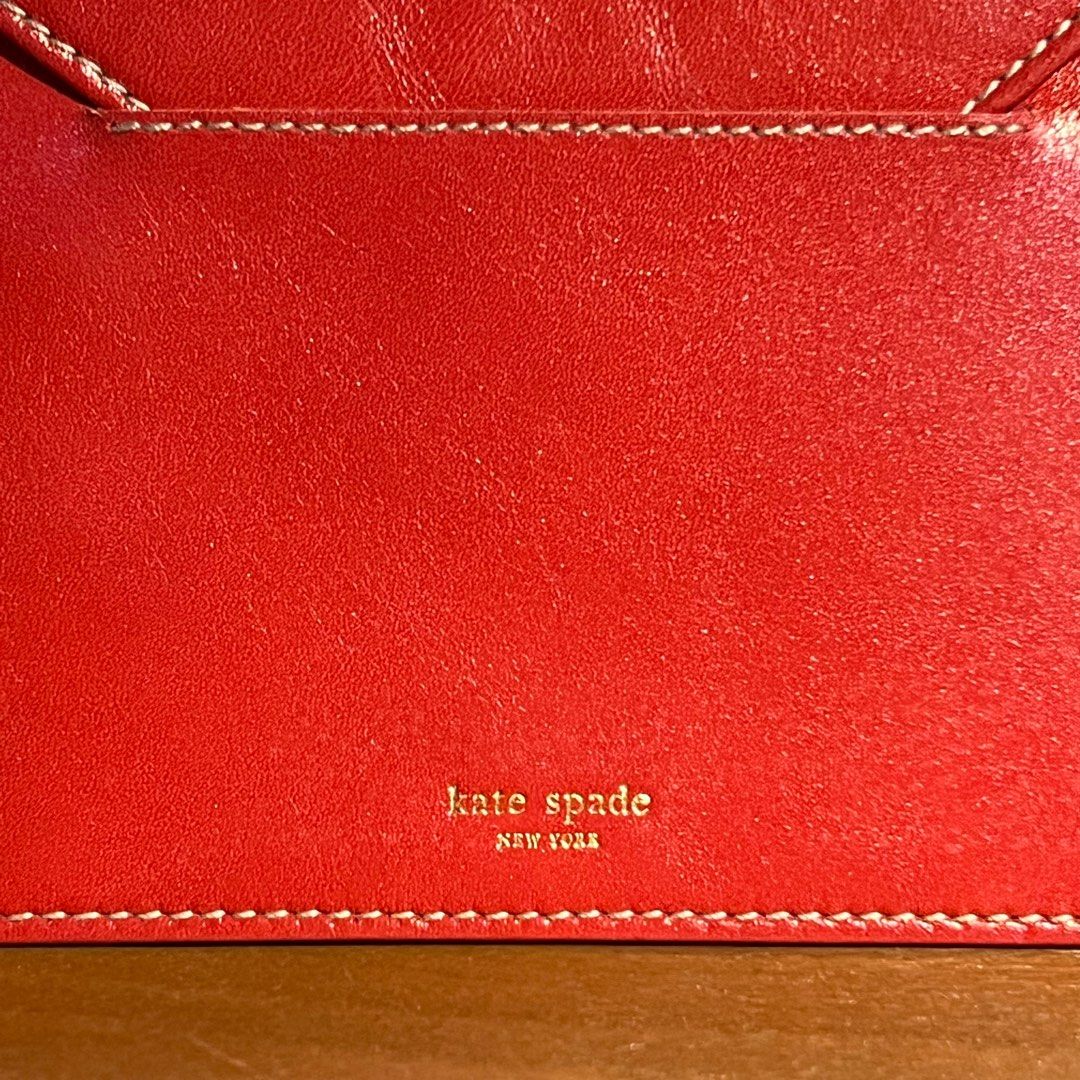Kate Spade Leather Organizers/Holder (Category: Wallets & Card holders) located in Binan City. Submitted by lovedbynins (Listing ID 1386507496, Image 3). Description: 2 Kate Spade red leather items made in Italy. •Trifold Picture Frame Wallet Height - 6 in Width - 4.5 in • Organizer or document holder, envelop-like Height - 5 in Width - 6.5 in Passport fits in both organizers. Please check and zoom photos to check for details and minor flaws. Tha