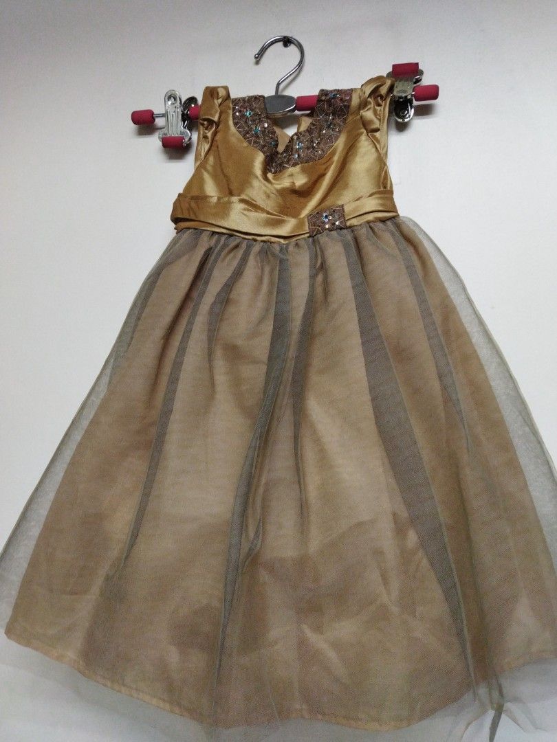 Kid girl dress (Category: Babies & Kids Fashion) located in Manila. Submitted by k3788 (Listing ID 1386532114, Image 1). Description: golden dress for parties.