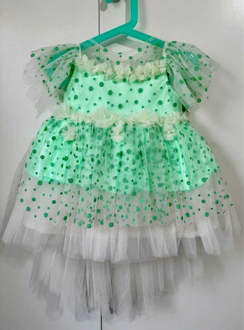 Mint Green & White Toddler Dress (BNWT) (Category: Babies & Kids Fashion) located in Paranaque City. Submitted by stella_vicky (Listing ID 1386477241, Image 1). Description: Brand new with tag, never worn. Pretty tulle skirt with satin-style bodice — great for birthdays, baptisms, flower girl outfits, or photoshoots. Size on tag says 18 but refer to the measurements below for best fit: 📏 Measurements: • Shoulder to Hem – 18” • Shoulder to Should