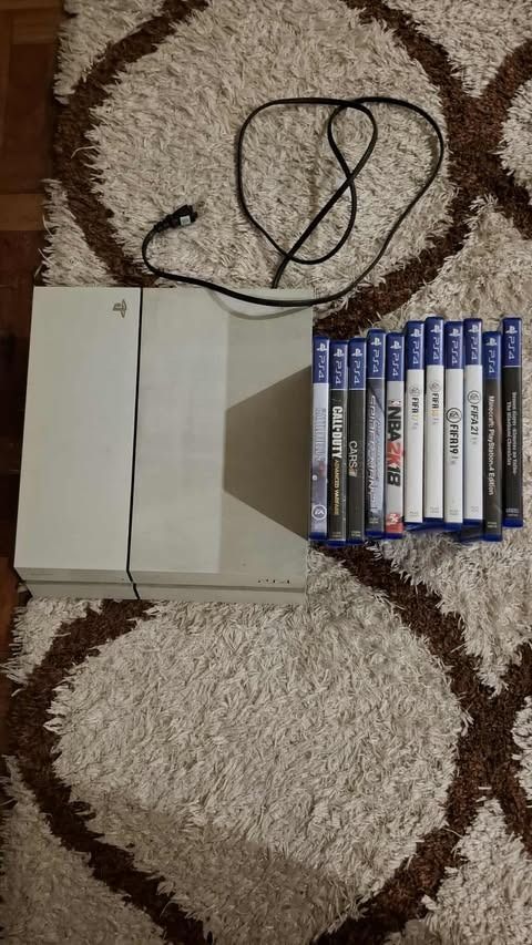 PS4 White Console + 2 Controllers + 11 Games — Excellent Condition, Bundle Deal (Category: PlayStation) located in Muntinlupa City. Submitted by varnangoel05 (Listing ID 1386521779, Image 1). Description: Selling my well-maintained white PlayStation 4 bundle, complete with: Console in great condition 2 controllers included 11 Original PS4 Games: FIFA 17, FIFA 18, FIFA 19, FIFA 21, The Amazing Spider-Man 2, Call of Duty: Advanced Warfare, Battlefi
