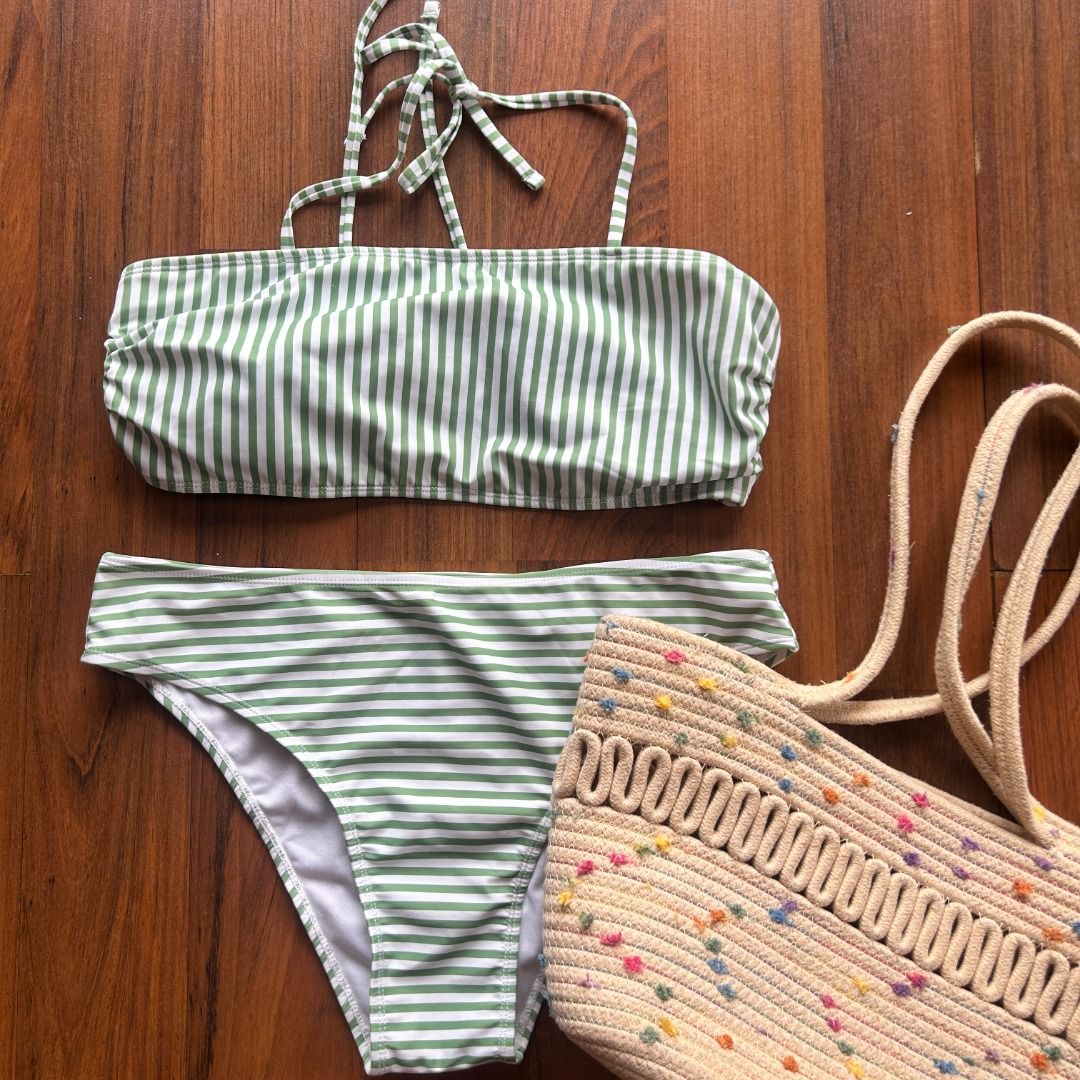 Striped Bandeau Bikini Set (Category: Bikinis & Swimsuits) located in Quezon City. Submitted by martits (Listing ID 1386470565, Image 1). Description: A chic bandeau two-piece with soft green and white stripes. Adjustable halter tie, perfect for customizable style and flattering fit. Wear it lounging poolside, as a crop top under lightweight cover-ups, or mix-and-match with high-waist shorts for summer festivals..