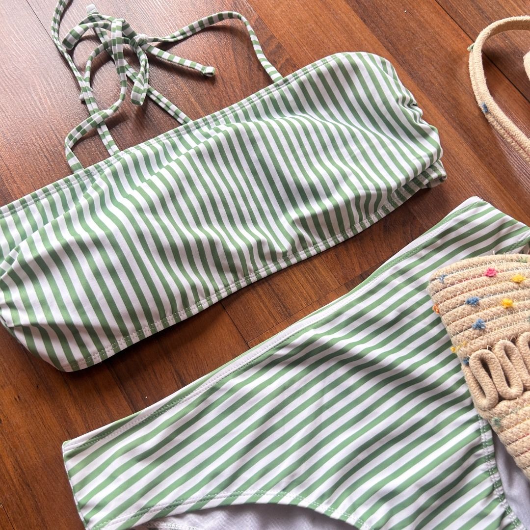 Striped Bandeau Bikini Set (Category: Bikinis & Swimsuits) located in Quezon City. Submitted by martits (Listing ID 1386470565, Image 2). Description: A chic bandeau two-piece with soft green and white stripes. Adjustable halter tie, perfect for customizable style and flattering fit. Wear it lounging poolside, as a crop top under lightweight cover-ups, or mix-and-match with high-waist shorts for summer festivals..