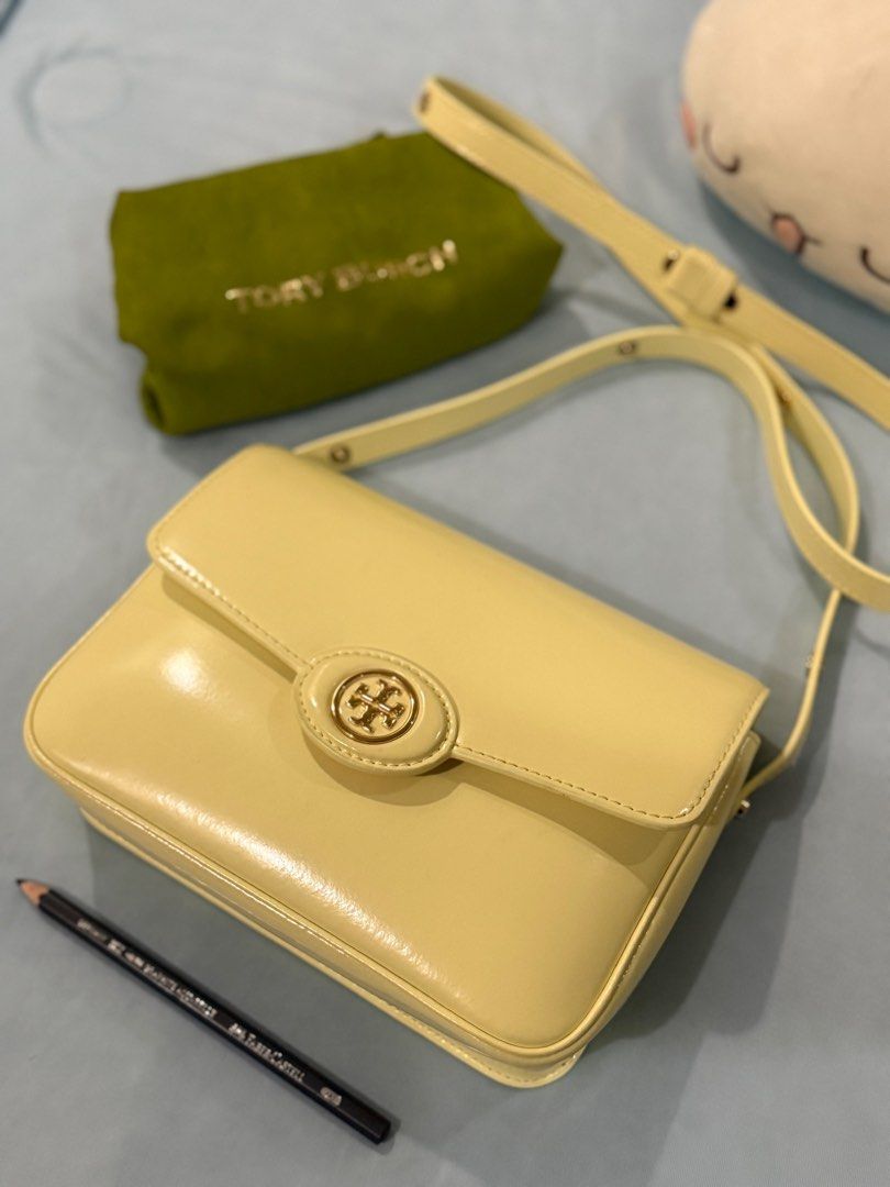 Tory Burch Robinson Spazzolato Convertible (Category: Luxury Bags & Wallets) located in Rizal. Submitted by gingerstreet (Listing ID 1386537380, Image 1). Description: Lemon yellow Spazzolato 6 x 15.5 x 21 (dhw in cm) Bought from Farfetch Shipped from Switzerland Patent leather 95% like new condition.