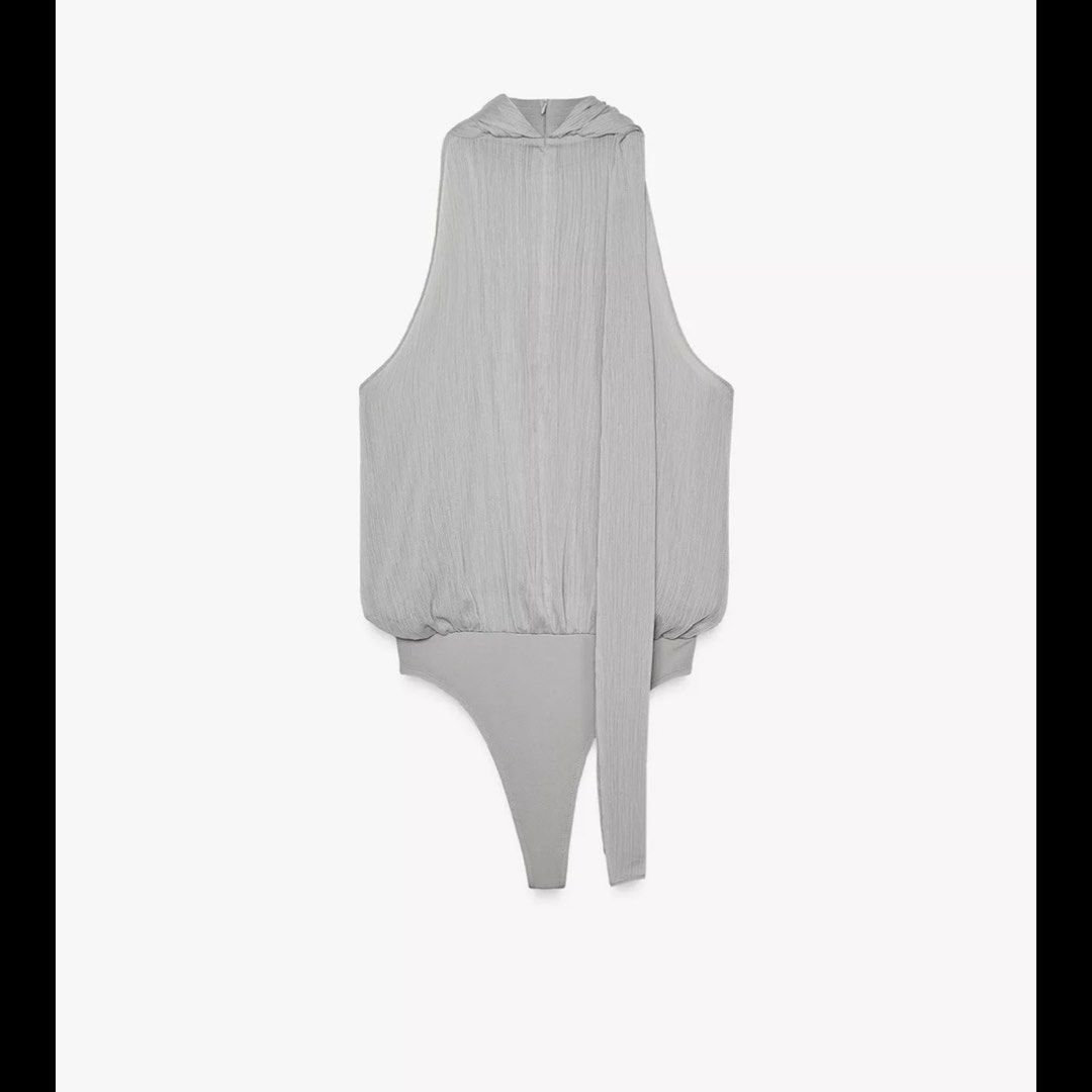 ZARA | Chiffon Bodysuit with Tie | BNWT Large (Category: Sleeveless) located in Quezon City. Submitted by mer.declutters (Listing ID 1386450036, Image 2). Description: Already sold out on Zara app! Tags still on, an impulse buy cause I am obsessed with tops with built in scarf!!! So chic hehehe 🥲 Super pretty! Chiffon so it's kinda see through, if you got what it takes to style them on— get this one hehe cause I don't Retails at 2,595 php .