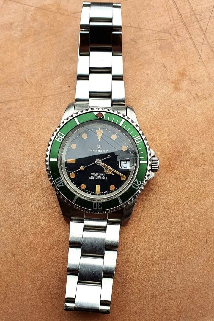 1980 SWISS SANDOZ SUBMARINER (Category: Luxury Watches) located in Lapu Lapu. Submitted by watchenthusiast4444 (Listing ID 1386639238, Image 1). Description: SWISS MADE SANDOZ VINTAGE SUBMARINER 40MM SIZE 10MM THICKNESS SWISS ETA 2824 AUTOMATIC MOVEMENT ALL ORIGINAL HEAD AFTERMARKET KERMIT INSERT PATINA DIAL VINTAGE ACRYLIC CRYSTAL BRACELET FIT TO 7.5INCH ULTRA RARE IN THIS CONDITION.