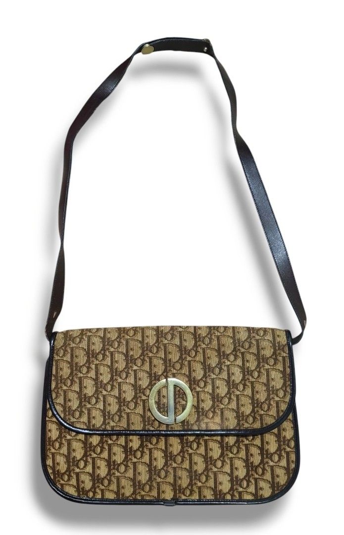 Authentic Christian Dior trotter shoulder bag (Category: Luxury Bags & Wallets) located in Donsol. Submitted by saksthriftavenuebyluckymaria8 (Listing ID 1386652639, Image 2). Description: Japan website selling this same bag for 50000 JPY 11in x 7.5in handle drop 17in excellent used condition * metal button closure can be closed and opened but bit loose *no holes no stains *corners are very fine * NO rubs *inside lining leather is intact no scuff