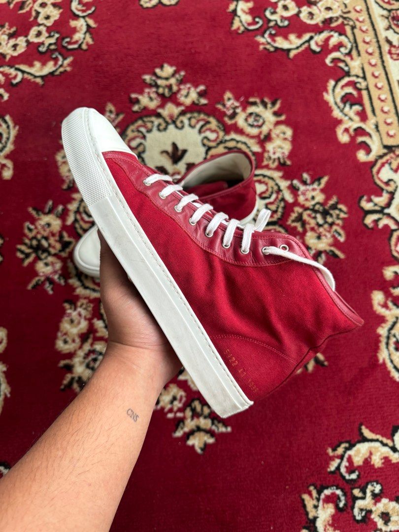 Common Projects Red Suede High Tops (Category: Sneakers) located in Quezon City. Submitted by jawnzslayer (Listing ID 1386618491, Image 2). Description: common projects red suede high tops no box, pair only size 43 fits 10-10.5 worn condition.