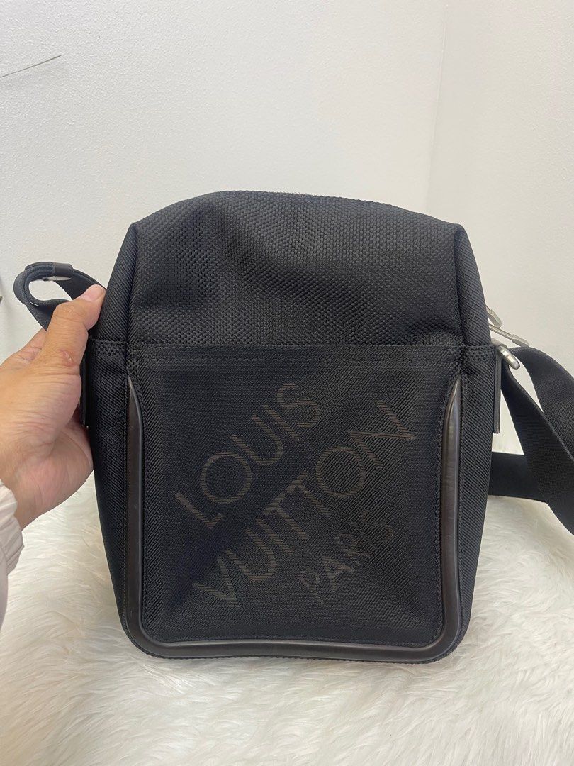 LOUIS VUITTON Black Damier Geant Citadin Messenger Bag (Category: Luxury Bags & Wallets) located in Taguig. Submitted by mluxeph (Listing ID 1386640204, Image 1). Description: LOUIS VUITTON Black Damier Geant Citadin Messenger Bag Gender: Men’s Material: Damier Geant polyamide and polyester jacquard canvas Stamp: SP0026 Year: 2006 Interior: One zipper compartment with Two open pockets Measurements: 8”L X 3.3”W X 10.5”H Handle Drop: 20.5” Hardware