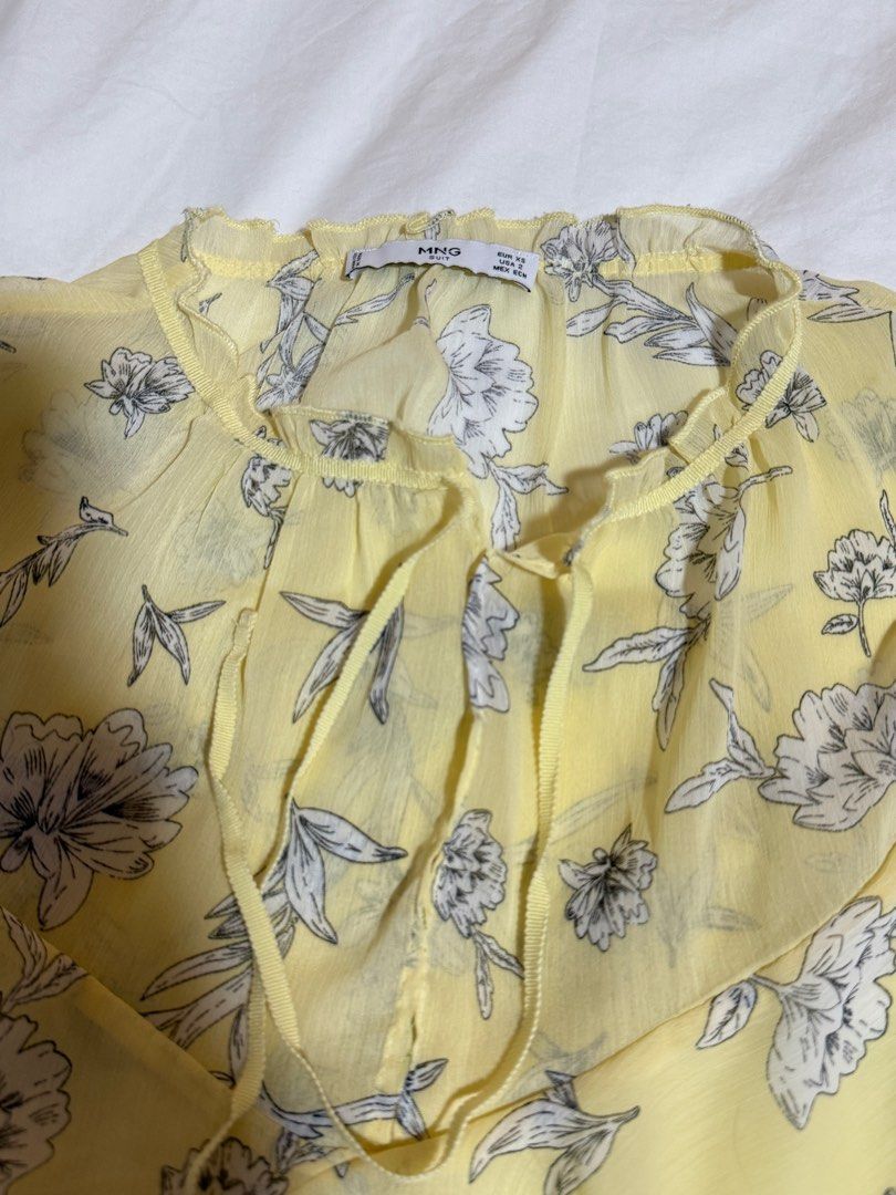 Mango yellow floral layered dress (Category: Dresses) located in Taguig. Submitted by ninsdeclutters (Listing ID 1386757108, Image 2). Description: - size: xs (but sizing seems bigger, so can fit up to S/M sizes) - used twice for events only - SO CUTE, flowy - no ww.