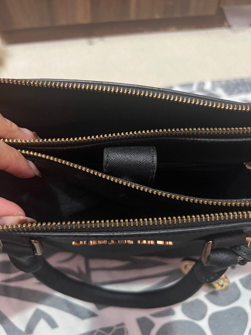 Michael Kors 2-way (Category: Luxury Bags & Wallets) located in Navotas City. Submitted by declutteringstuff_ph (Listing ID 1386731287, Image 2). Description: Medium size Original MK 2-way Gold hardware Signs of usage but still in good condition .