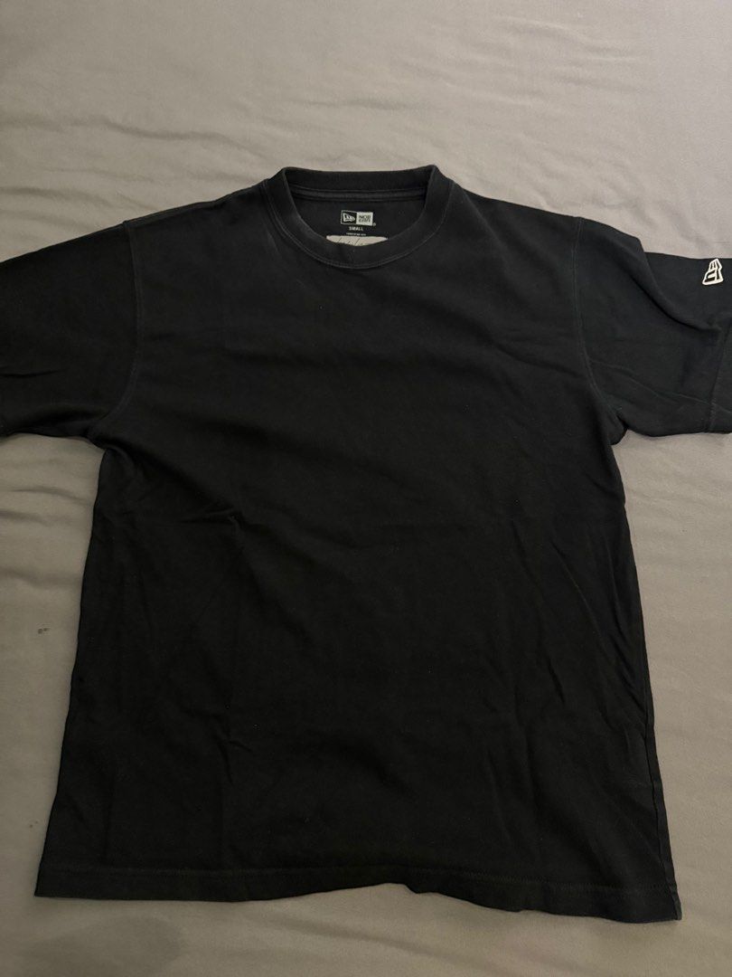 New Era x Yohji Yamamoto T-shirt - Small (Category: Tshirts & Polo Shirts) located in Singapore. Submitted by canshsm (Listing ID 1386639865, Image 2). Description: - Authentic/Not os - New Era x Yohji Yamamoto collaboration T-shirt - Black color - Size: Small - Features 'No Future' graphic on the back - New Era logo on sleeve - Perfect for fans!.