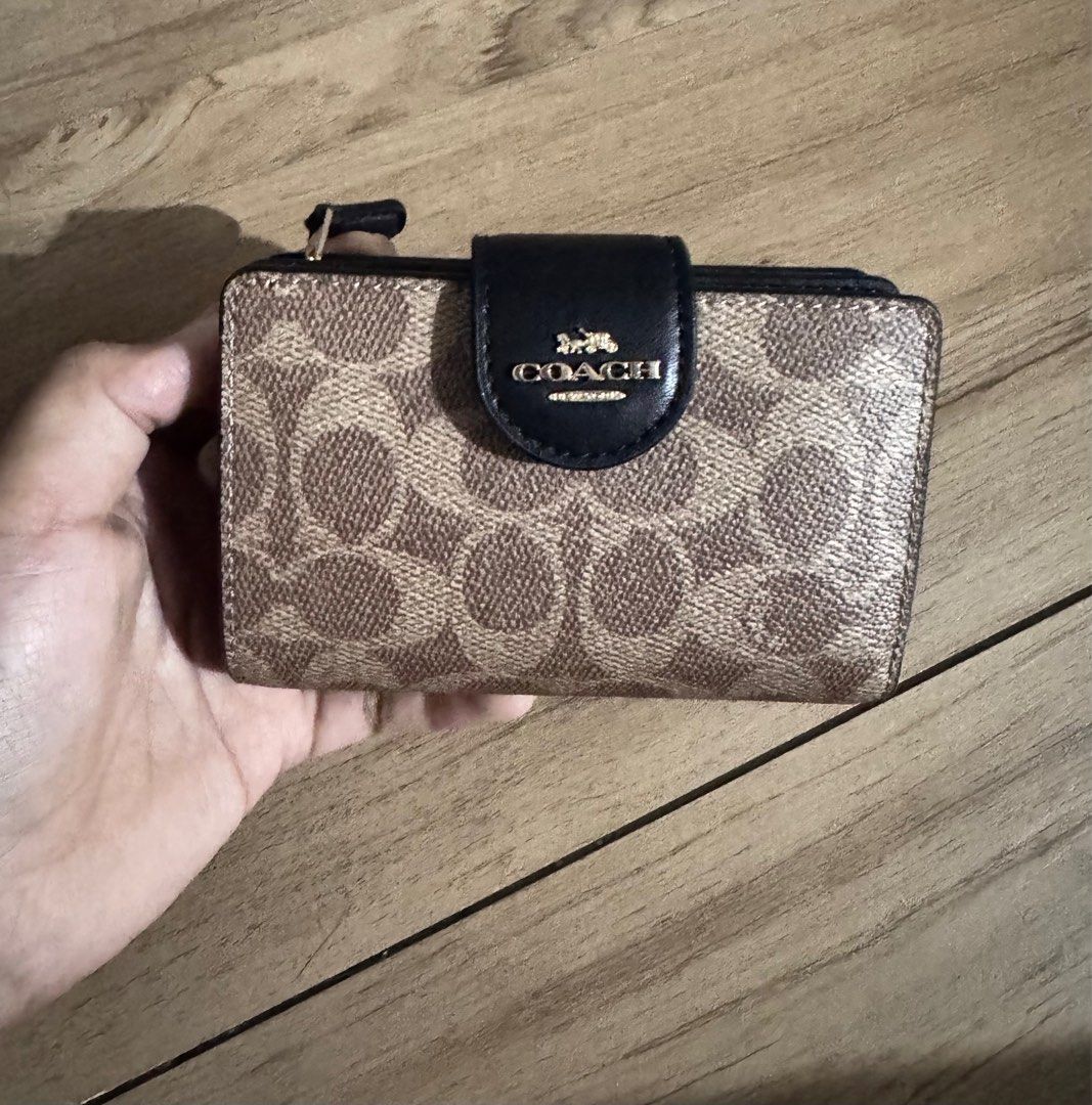 Original Coach Medium Corner Zip Wallet (Category: Wallets & Card Holders) located in Quezon City. Submitted by decluttrqueen (Listing ID 1386744594, Image 1). Description: ‼️Sale‼️ From 5350PHP down to 5000PHP Brand new Original from the US Coach medium corner zip in black/tan With care card and tag 128USD on tag Can do 3 months layaway 0% interest with 1k deposit (non-refundable) Shipment of item upon full payment RFS: Change of mind.