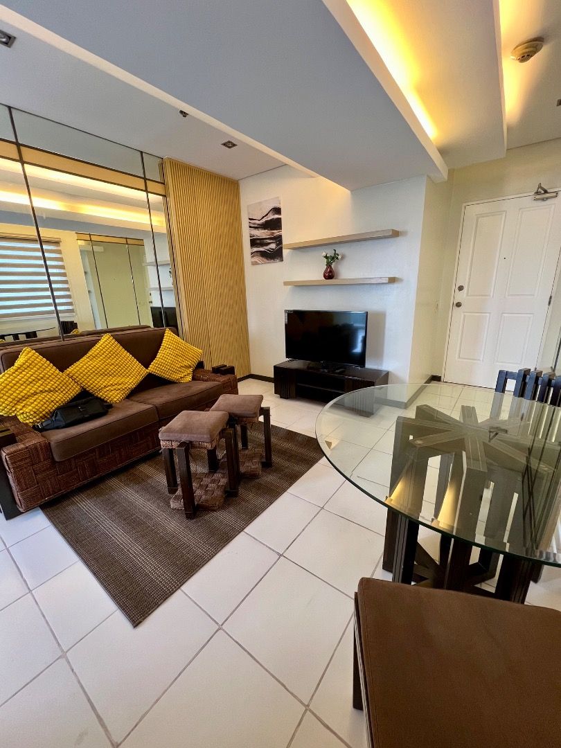 The Columns Ayala Avenue 1BR (Category: Apartments & Condos) located in Pasay City. Submitted by _russ_ (Listing ID 1112199114, Image 2). Description: 1br fully furnished and interior decorated unit approximately 52 sq.m. with balcony customized living room sofa bed 4 seater customized dining set 2 seater breakfast nook living room a/c 40 inch smart tv refrigerator microwave oven range hood electric stove granite finish kitchen top Vacuum cleaner
