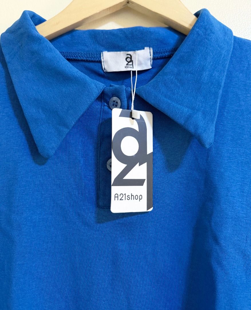 A21 Shop (Bangkok) blue top (Category: Blouses) located in Quezon City. Submitted by homestyleplus (Listing ID 1386803041, Image 2). Description: A21 Shop (Bangkok) blue top - Bought in Bangkok - chest: 34"-40" (approximate) - length: 21.75" (approximate) - with hang tag *color of item on photos may vary from its actual color due to editing/lighting ----- MOP: BPI / Gcash First to pay basis No COD, no rush shipping, no Sh0pee checkout - Pick-up/d