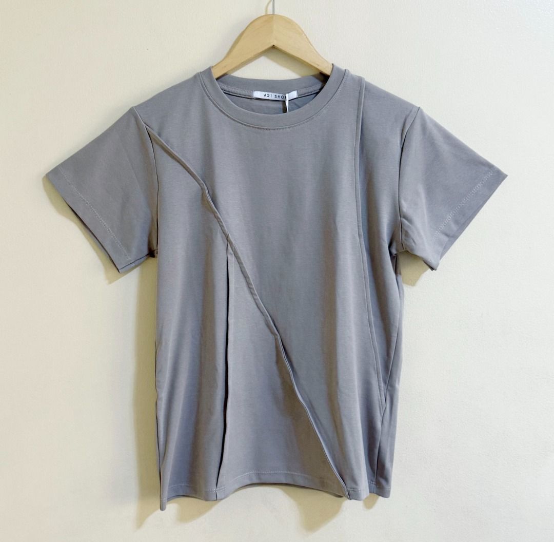 A21 Shop (Bangkok) gray top (Category: Blouses) located in Quezon City. Submitted by homestyleplus (Listing ID 1386803311, Image 1). Description: A21 Shop (Bangkok) gray top - Bought in Bangkok - chest: 36"-42" (approximate) - length: 24.5" (approximate) - with hang tag *color of item on photos may vary from its actual color due to editing/lighting ----- MOP: BPI / Gcash First to pay basis No COD, no rush shipping, no Sh0pee checkout - Pick-up/de