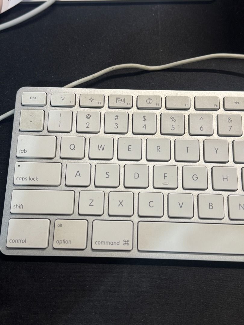 Apple Wired Aluminum Magic Keyboard A1243 – Full-Size with Numeric Keypad (Preloved) (Category: Computer Keyboard) located in Toledo. Submitted by xoxreina (Listing ID 1386908322, Image 2). Description: Selling an Apple Wired Aluminum Magic Keyboard (Model A1243) — the classic, durable keyboard with a sleek aluminum finish and built-in numeric keypad. Condition: Preloved, fully functional. Keys have a slight yellowish tint due to age, but this do