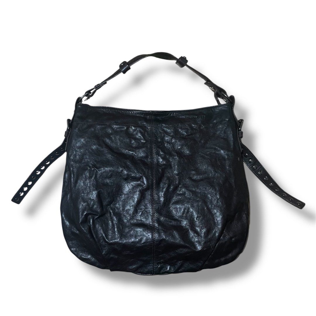 FIORUCCI crumpled leather shoulder bag/ kili bag (Category: Luxury Bags & Wallets) located in Bulacan. Submitted by theclosetsale.ph (Listing ID 1386830360, Image 1). Description: On SALE ! 📣📣📣 FIORUCCI shoulder bag in Deep chocolate. Genuine cowhide leather. Edgy-looking shoulder bag. Very versatile at it also looks like color black in photos (check last two photos). Silver hardwares and studs on the straps. Subtle logo on front. Metal plate 