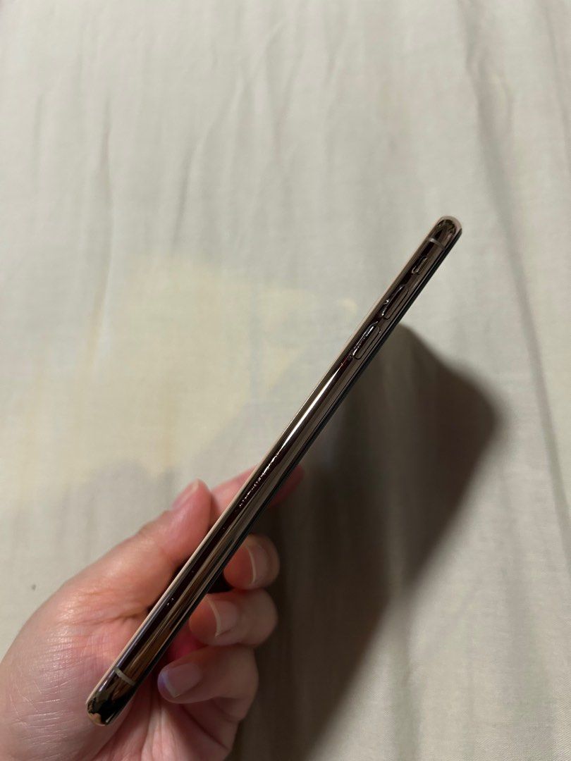 Gold iPhone XS Max 64GB (Category: iPhone X Series) located in Pasig City. Submitted by jalo.vault (Listing ID 1386881446, Image 3). Description: Gold iPhone XS Max 64GB ₱6,999 negotiable ‼️ NO TO LOW BALLERS **WILL NOT ENTERTAIN NEW ACCOUNTS • Factory Unlocked (open line, any SIM) • All functions working and smooth interface •Good condition 94% smooth (normal signs of use) • 79% Battery Health (Never Replaced Battery) •True Tone working • Replac