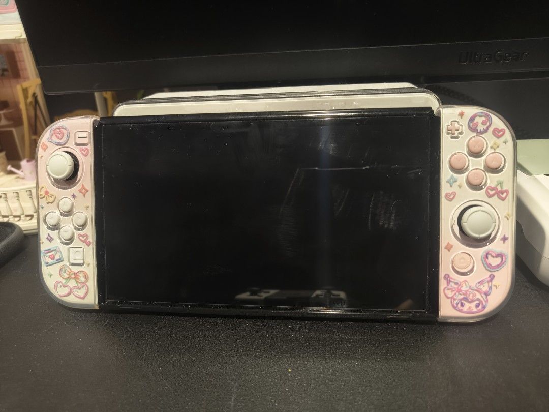 Nintendo Switch OLED (Category: Nintendo) located in Singapore. Submitted by mavelle_ (Listing ID 1386924924, Image 2). Description: Rarely used 2 sets of joystick (one original one that came with the Nintendo switch + one customised authentic joy stick worth $100) screen protector and casing since day 1 what you see is what you get. have box not warranty as I've lost the receipt, however this was bought less than 1 year ago. not looking to trade