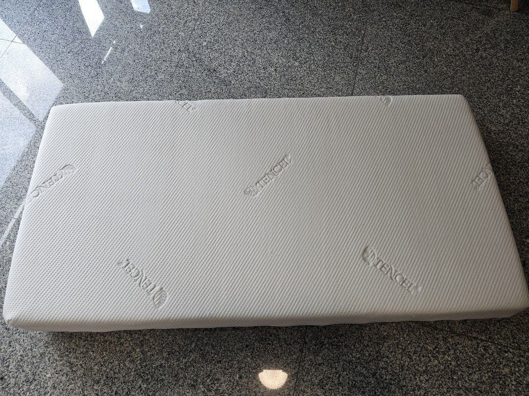 Tencel Mattress for kids (Category: Bed Frames & Mattresses) located in Singapore. Submitted by hamsumlim (Listing ID 1386880194, Image 2). Description: - Tencel material is known for its softness and breathability, providing a comfortable sleep surface. Perfect for adding an extra layer of comfort to your bed. - Size: 120cm x 62cm x 13cm thinkness - Rarely used as kid still prefer to sleep with us, and already prepared a bigger mattress when he 
