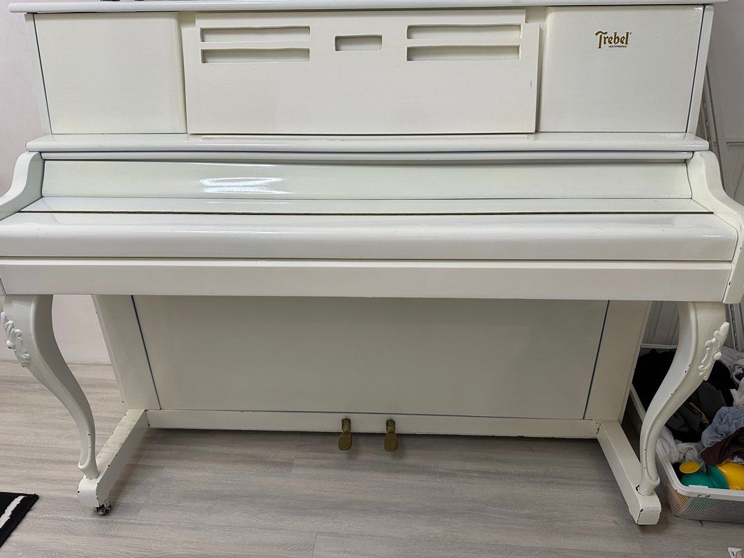 Trebel Piano comes with chair (Category: Musical Instruments) located in Paranaque City. Submitted by innersmile (Listing ID 1386793467, Image 2). Description: Just painted with white color. Needs tuning and fix.