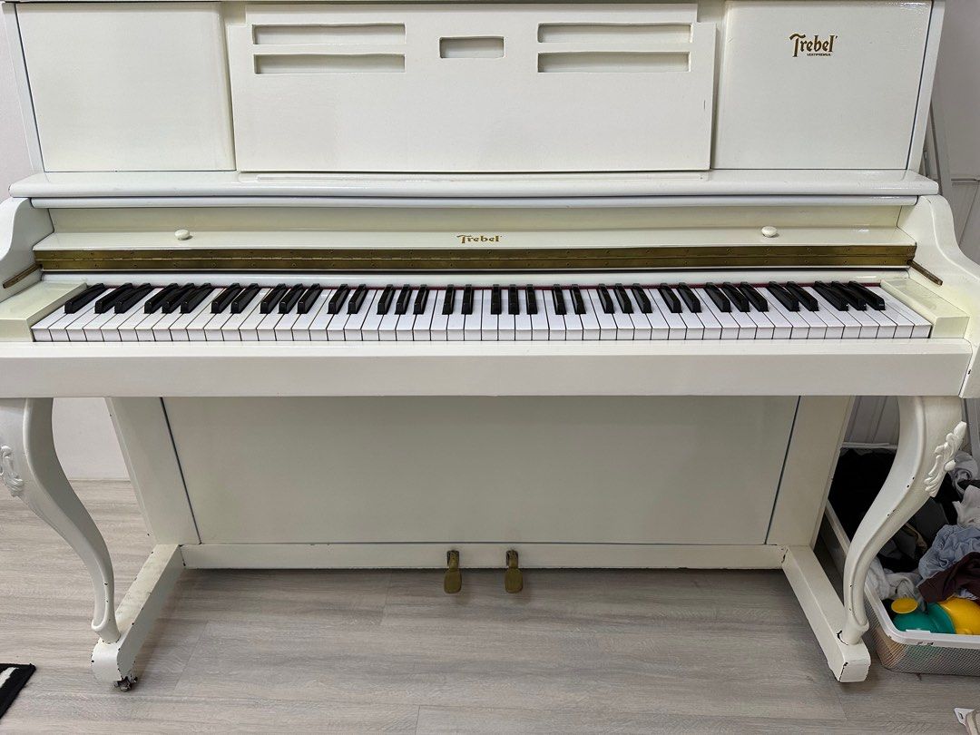 Trebel Piano comes with chair (Category: Musical Instruments) located in Paranaque City. Submitted by innersmile (Listing ID 1386793467, Image 1). Description: Just painted with white color. Needs tuning and fix.
