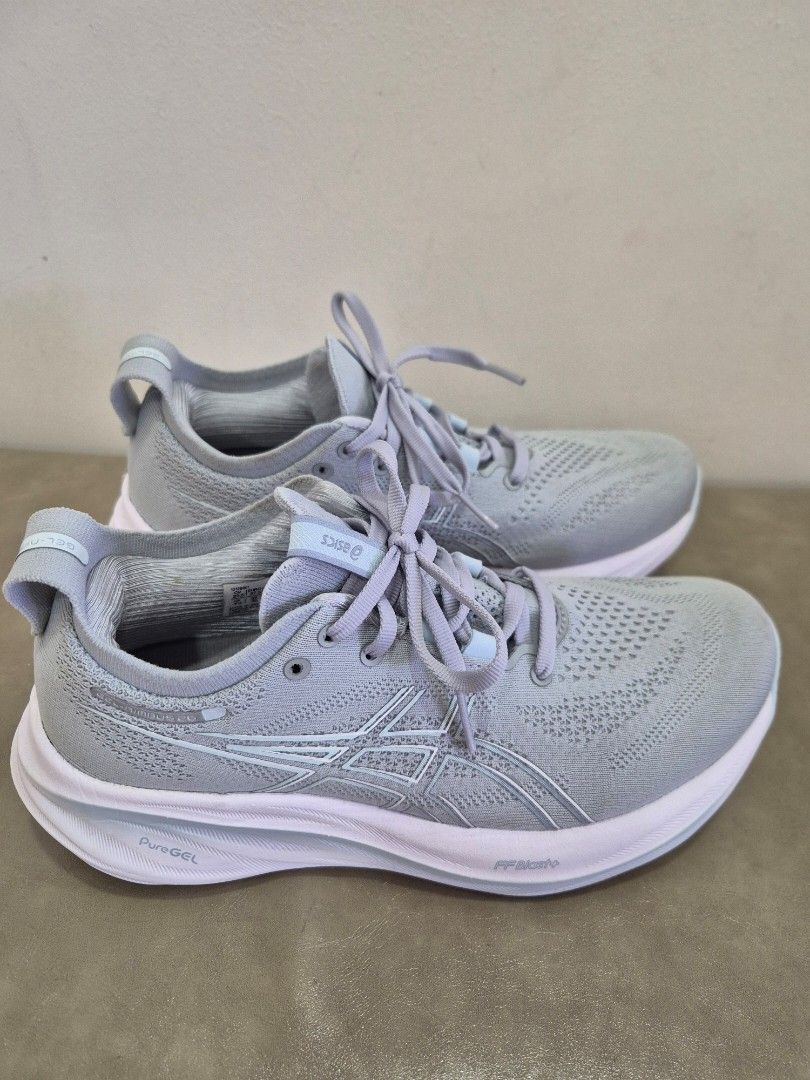 ASICS Gel Nimbus 26 Running Shoes - Grey (Category: Sneakers) located in Singapore. Submitted by vvgirl2021 (Listing ID 1386989351, Image 2). Description: Bought $269 but wrong size. Too big. Only use for 3 times. - ASICS Gel Nimbus running shoes - Size: CM 23.5 / Euro 37.5 / US 6 1/2 / UK 4 1/2 - Light grey color - Breathable knit upper - Thick white sole - Excellent condition - Suitable for running and everyday use.