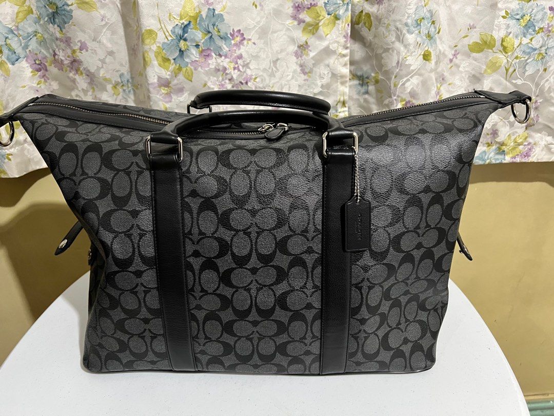 Coach overnight travel bag (Category: Luxury Bags & Wallets) located in Quezon City. Submitted by bella_ciao (Listing ID 1386967899, Image 2). Description: For pick up only Location: Don Antonio QC Lost strap .