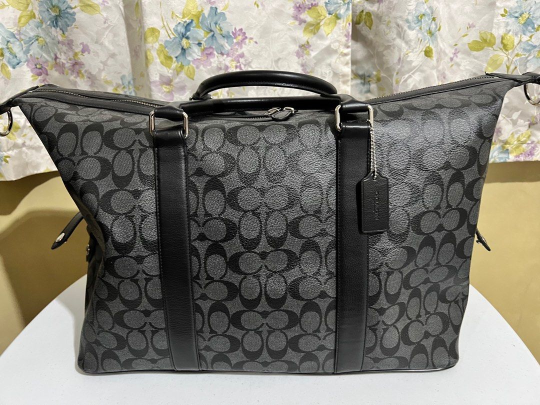 Coach overnight travel bag (Category: Luxury Bags & Wallets) located in Quezon City. Submitted by bella_ciao (Listing ID 1386967899, Image 1). Description: For pick up only Location: Don Antonio QC Lost strap .